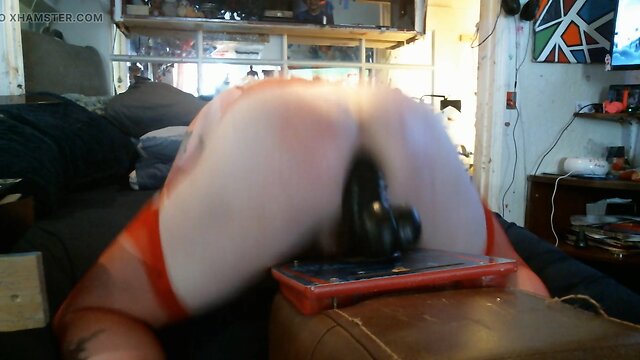 Crossdresser bouncing on a phallus!