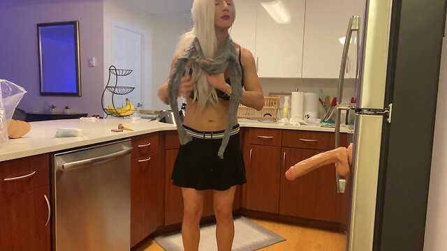 Crossdresser fucked with dildo in kitchen