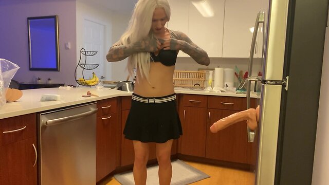 Crossdresser fucked with dildo in kitchen