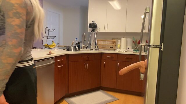 Crossdresser fucked with dildo in kitchen