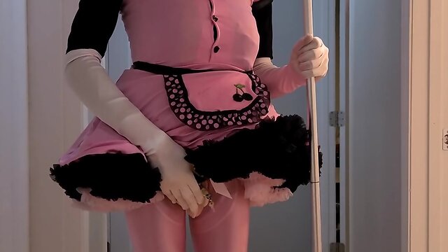 Rubberdoll displays and cleans outfit