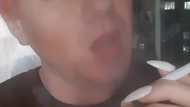 Sonyastar: transvestite smoking with long nails and red hair