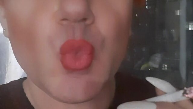 Sonyastar: transvestite smoking with long nails and red hair