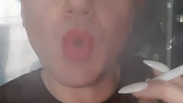 Sonyastar: transvestite smoking with long nails and red hair