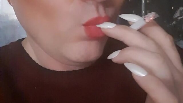 Sonyastar: transvestite smoking with long nails and red hair