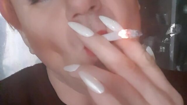 Sonyastar: transvestite smoking with long nails and red hair