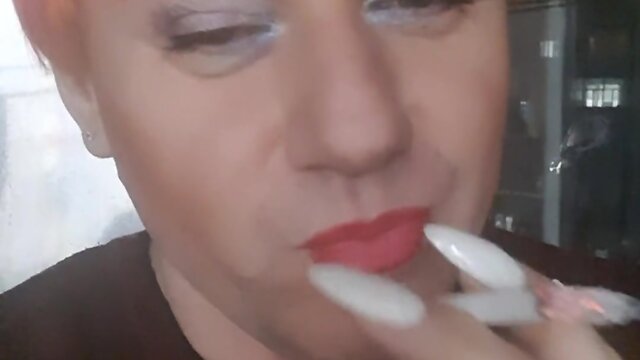 Sonyastar: transvestite smoking with long nails and red hair