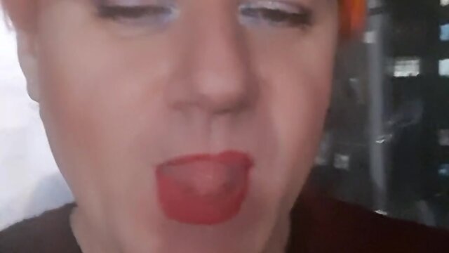 Sonyastar: transvestite smoking with long nails and red hair