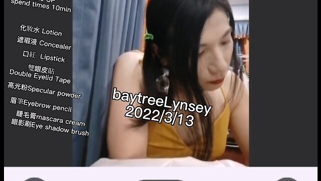 Ms. lynsey applies makeup on webcam