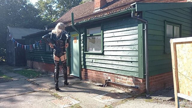 Transgender person in pvc outdoors