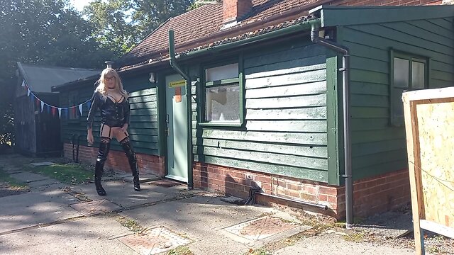 Transgender person in pvc outdoors