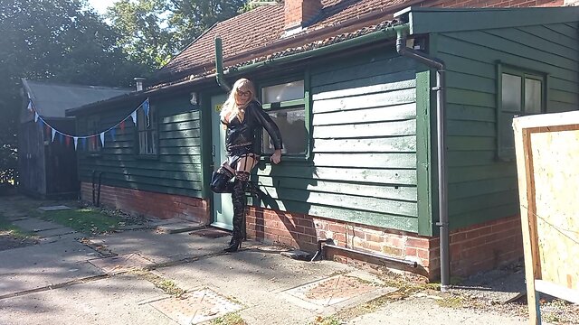 Transgender person in pvc outdoors