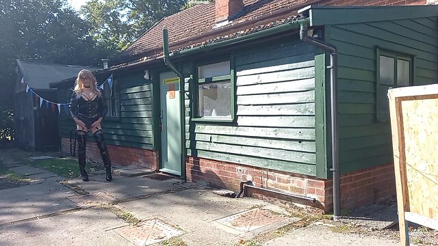 Transgender person in pvc outdoors