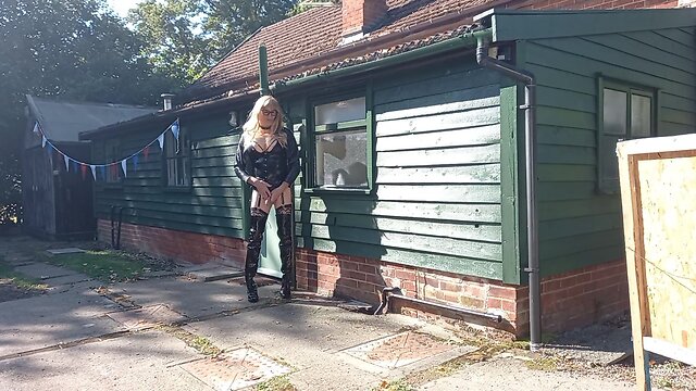 Transgender person in pvc outdoors