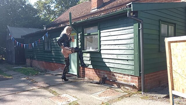 Transgender person in pvc outdoors