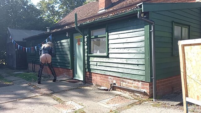 Transgender person in pvc outdoors