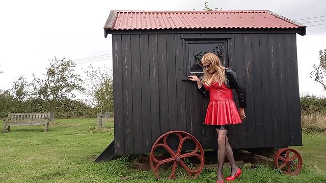 Pvc-clad trans person cumming outdoors in the rain