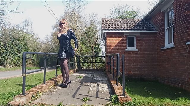 Gina in pvc performing at village hall