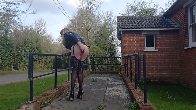 Gina in pvc performing at village hall