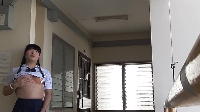 Showing school uniform to an elderly person