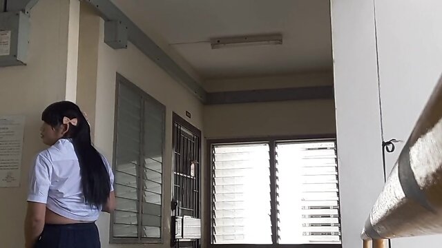 Showing school uniform to an elderly person