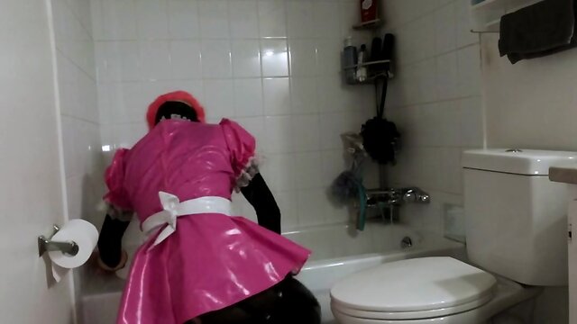 Steel chastity belt and dildo cleaning bathroom by a sissy maid