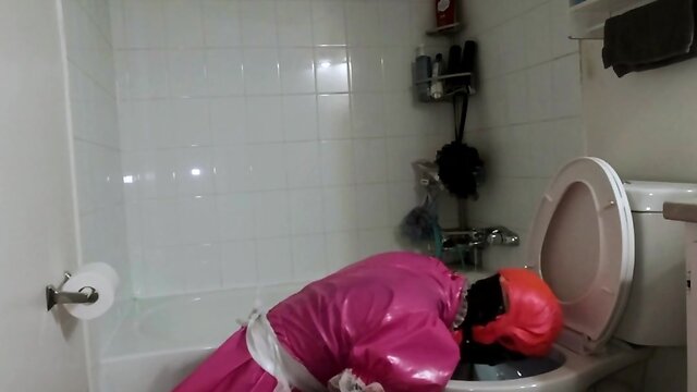 Steel chastity belt and dildo cleaning bathroom by a sissy maid