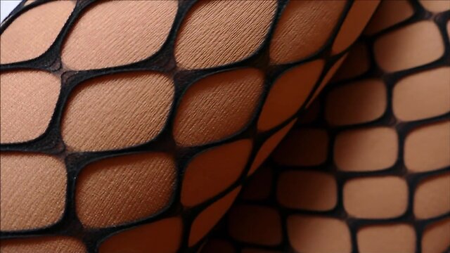 Monique in patent ballet heels and fishnet tights