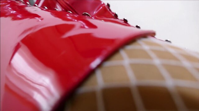 Monique in red hooker boots with rubber dolls