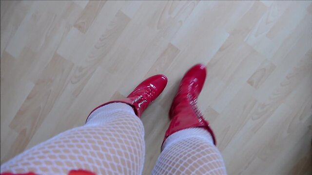 Monique in red hooker boots with rubber dolls