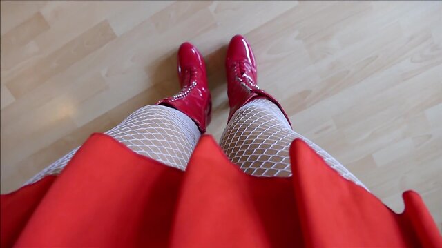 Monique in red hooker boots with rubber dolls