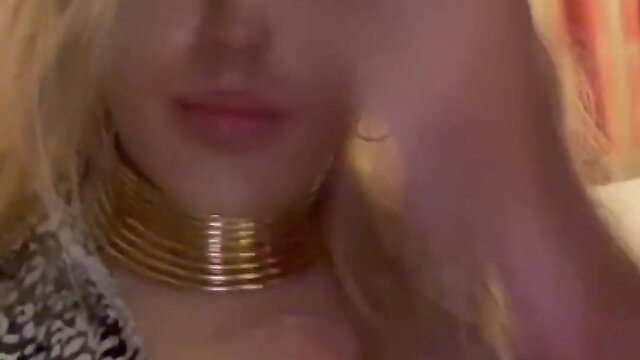 Blonde woman in 6 inch heels sucking dildo