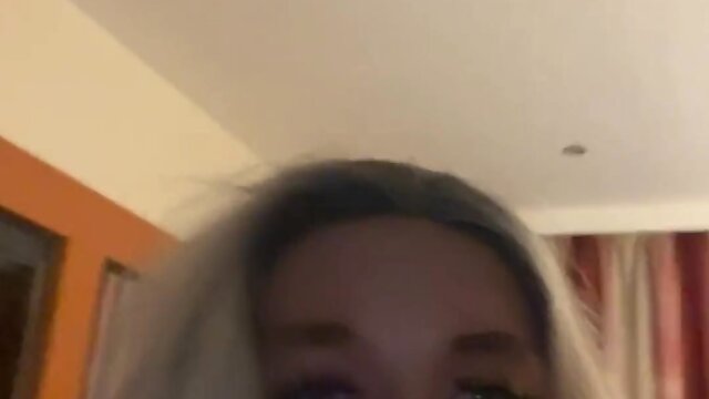 Blonde woman in 6 inch heels sucking dildo