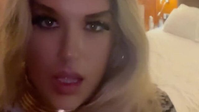 Blonde woman in 6 inch heels sucking dildo