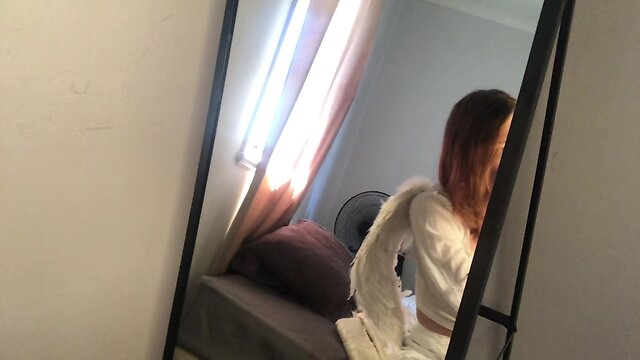 Angel ejaculates on a mirror