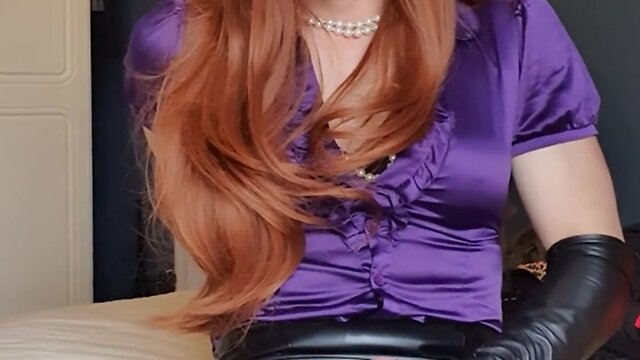Ginger secretary in a purple satin blouse