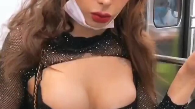 Subway rider caught flashing breasts in public - recorded