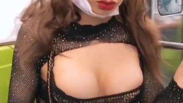 Subway rider caught flashing breasts in public - recorded