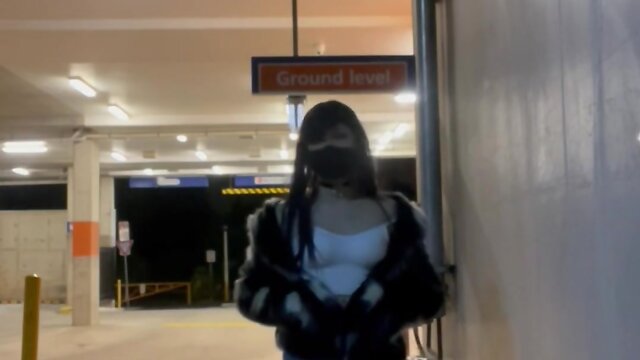 Exploring train station and parking lot in fishnet stockings