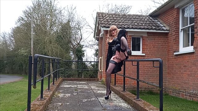 Squirting crossdresser in pvc masturbates outdoors