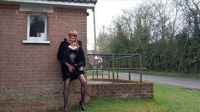 Squirting crossdresser in pvc masturbates outdoors