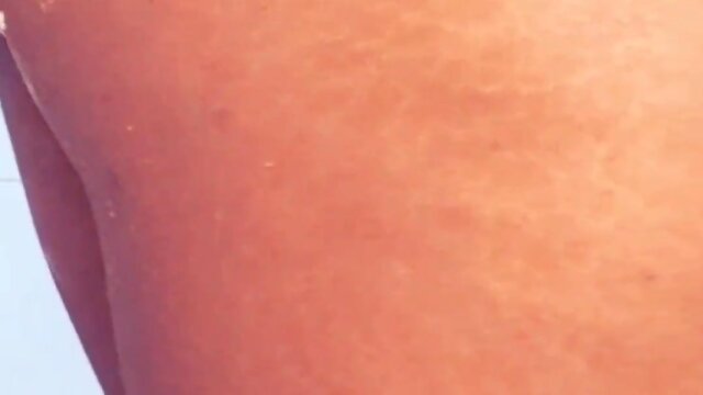 Attempting to insert a dildo in the butt