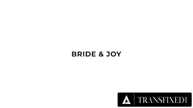 Lesbian trans bride and cis wife share intimate honeymoon moment