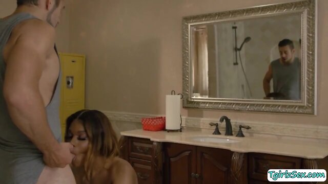 Voluptuous ebony trans woman gives sensual blowjob