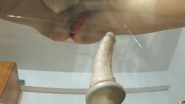 Intimate red lingerie and a sensual dildo close-up