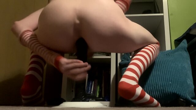 Close call: sissy riding a big black dildo almost gets caught!