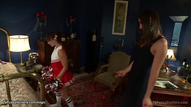 Shemale with a huge cock takes on a cheerleader