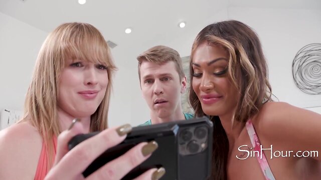 Two stunning transsexuals took advantage of a clueless guy in this hot scene