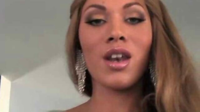 Busty tgirl in a sexy lingerie jerks off