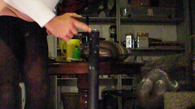 Nasty crossdresser sits on a stick